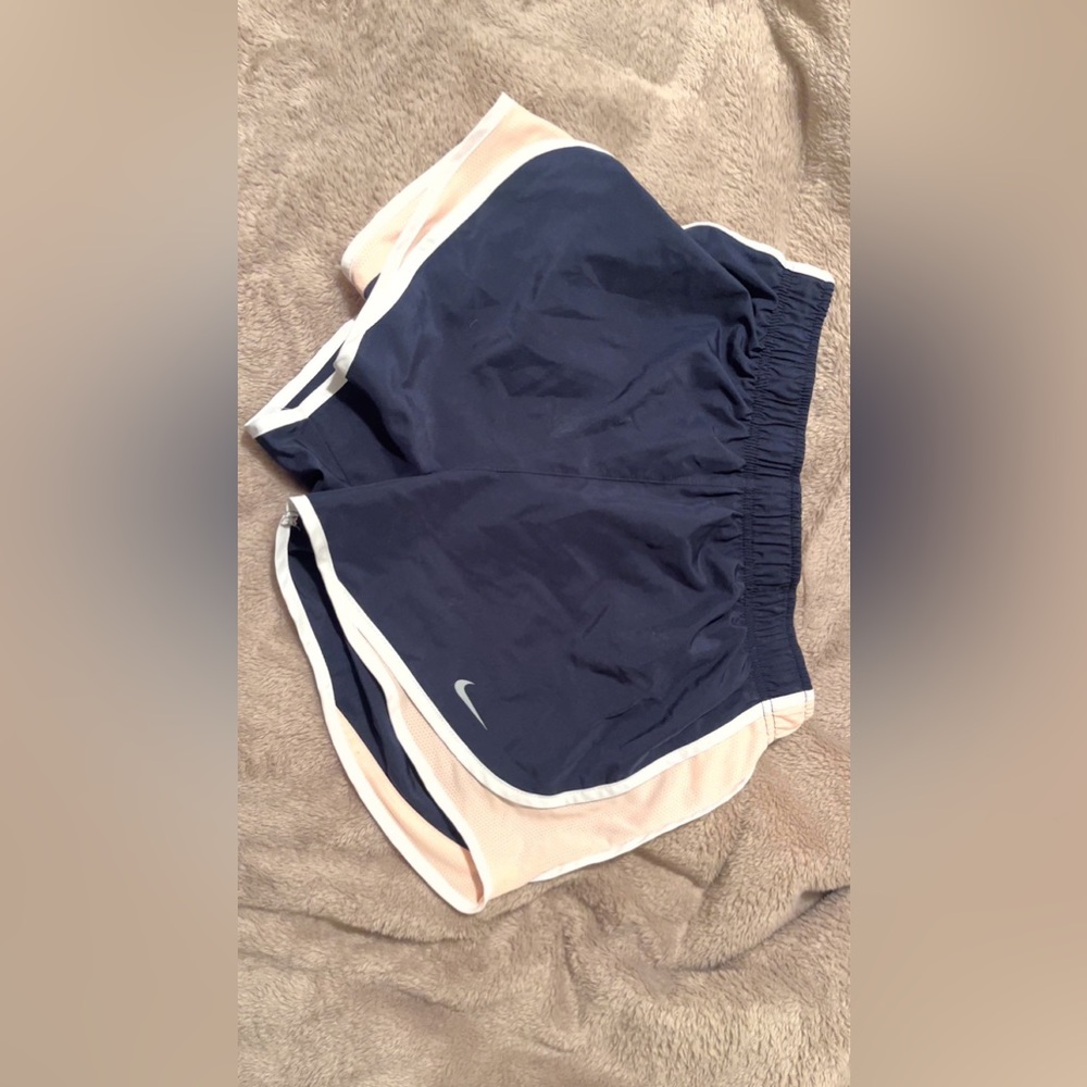 size small brand, Nike colors, dark blue, pink,